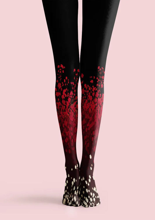 Black printed tights with red floral gradient and small white blossoms near the feet