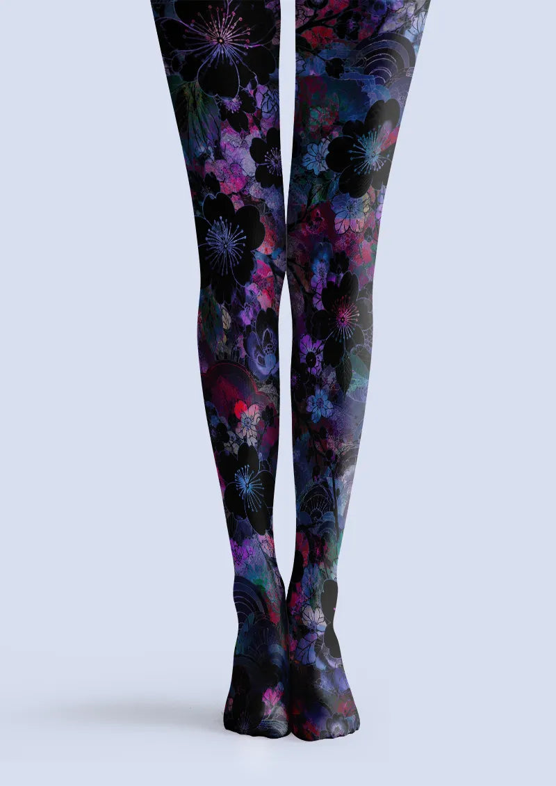 Black printed tights with layered purple and blue blossoms, dark flowers and pink floral accents